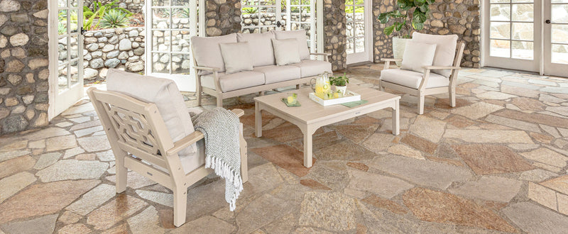 Outdoor deep seating patio furniture collection arranged on an enclosed patio, showcasing POLYWOOD’s premium craftsmanship.