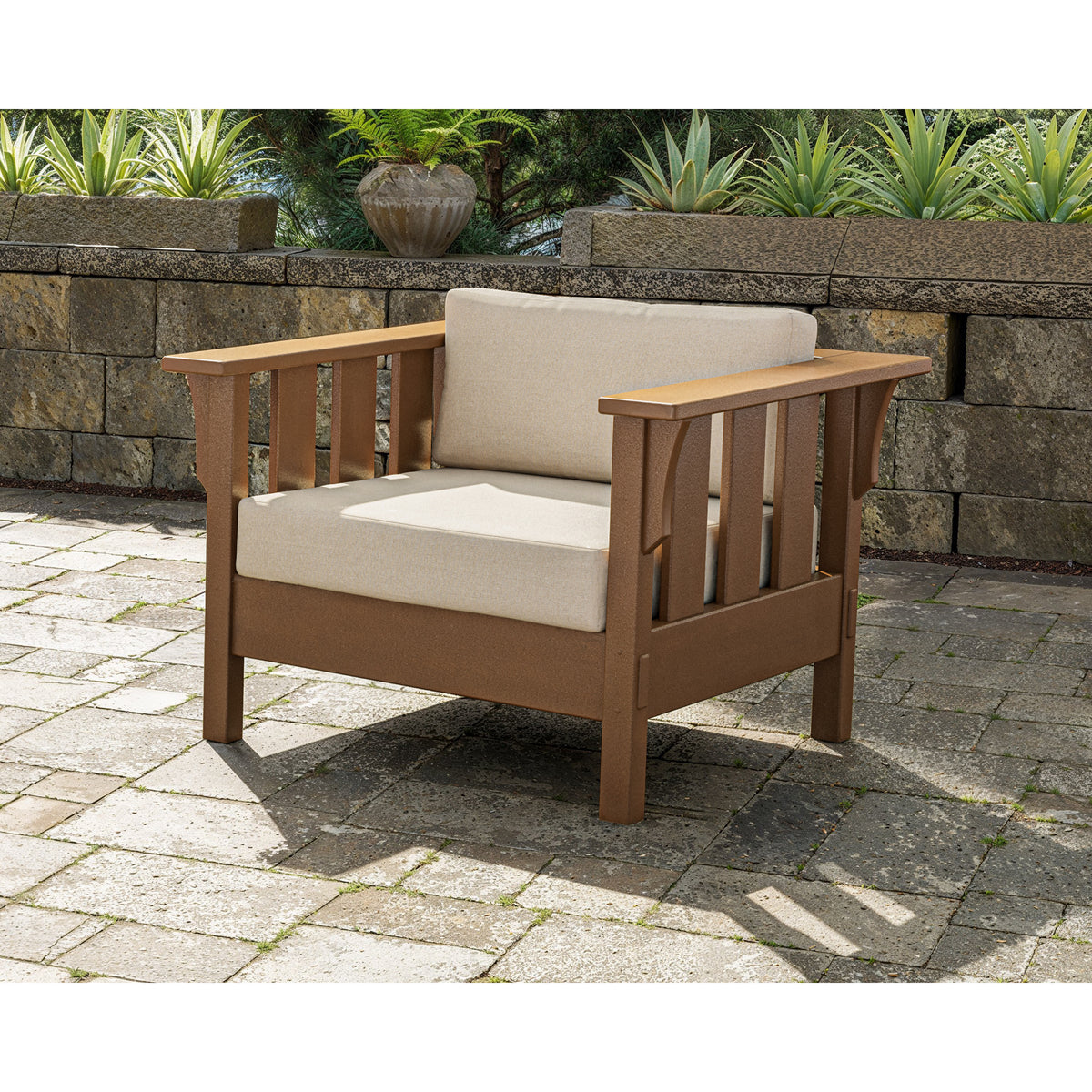 Single deep seating chair in brown finish with beige cushion